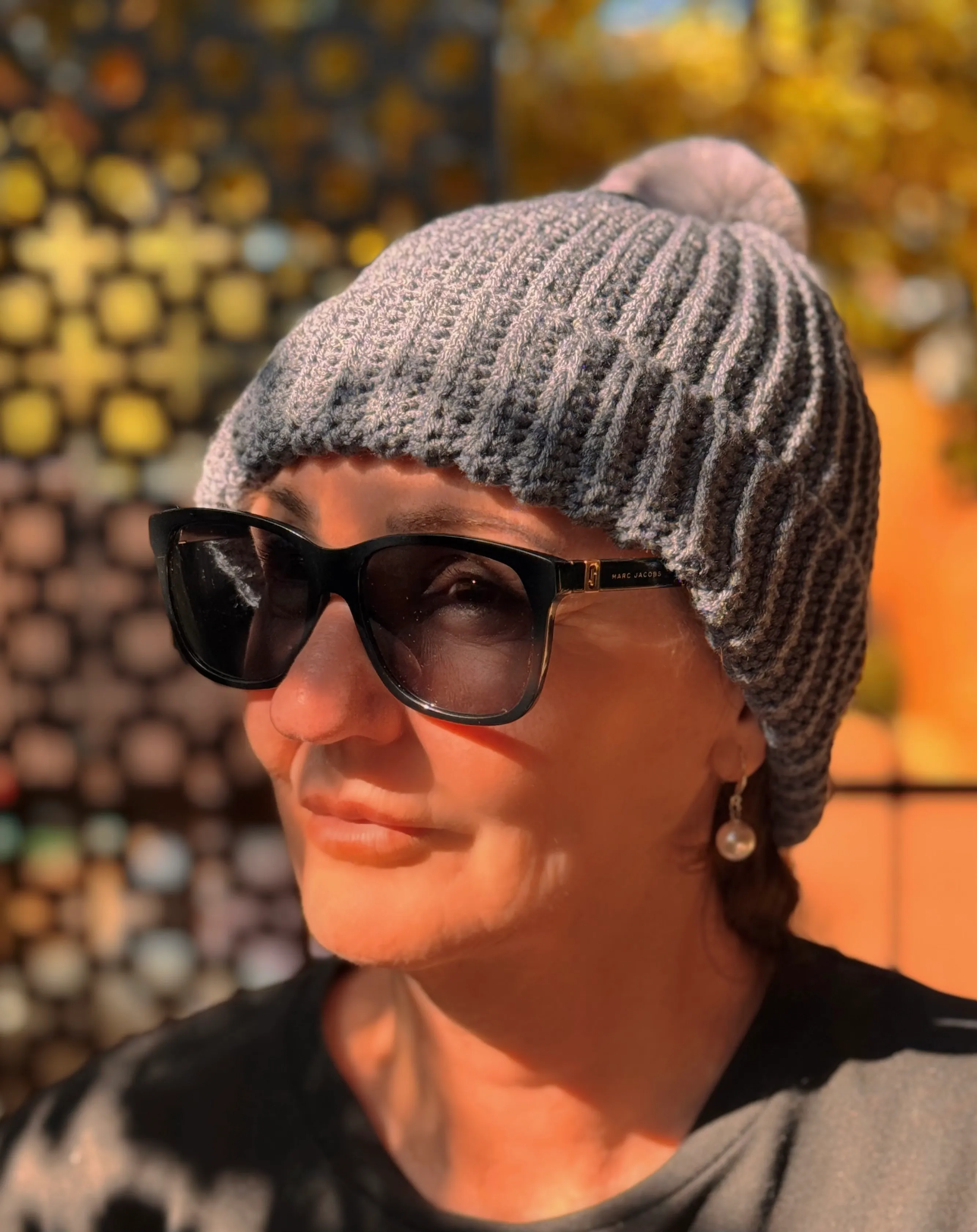 Photo of Jenny with beanie in glasses..