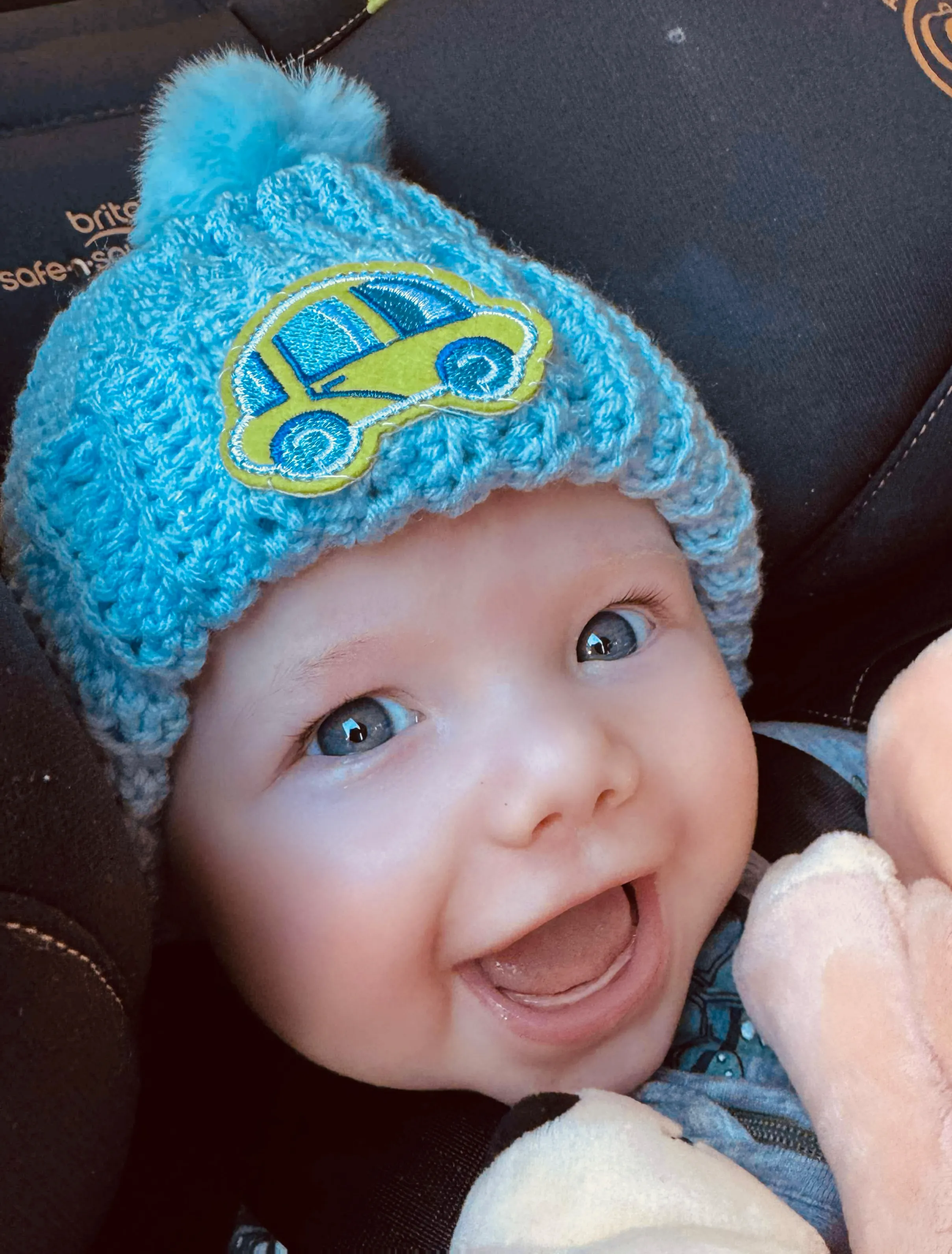 Baby blue ribbed beanie with a bus patch.
