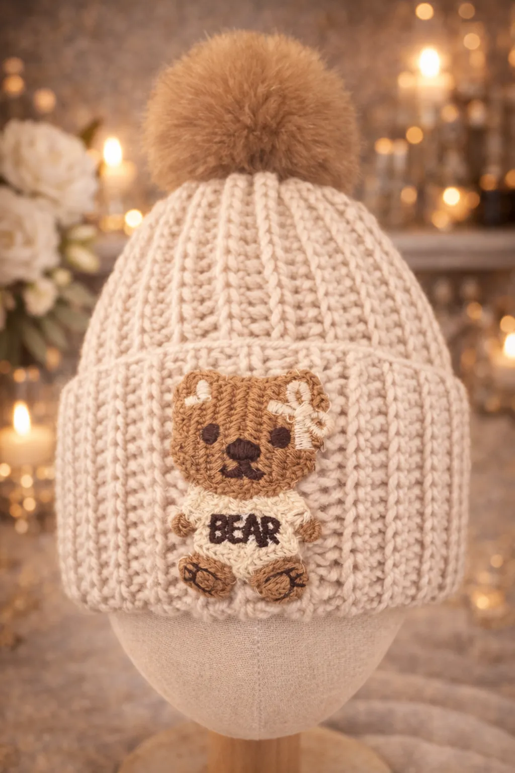 Cream ribbed kids beanie with honey pom and hand-crocheted BEAR character on top.
